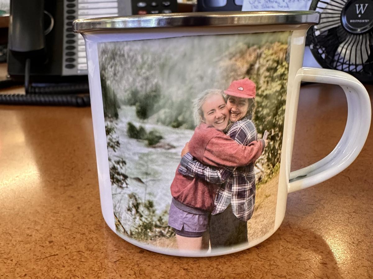 Photo of two sisters hugging put on a mug