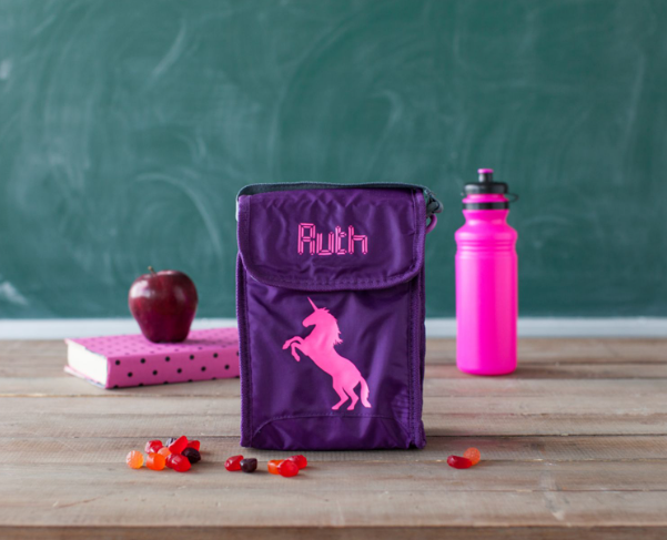 Purple lunch box with the name ruth on it 